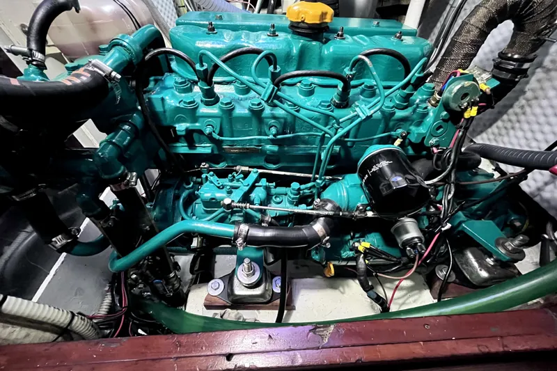 Arma Di Re Yacht Photos Pics Engine of a 1983 Hallberg-Rassy 42E sailboat, showcasing detailed mechanical components.