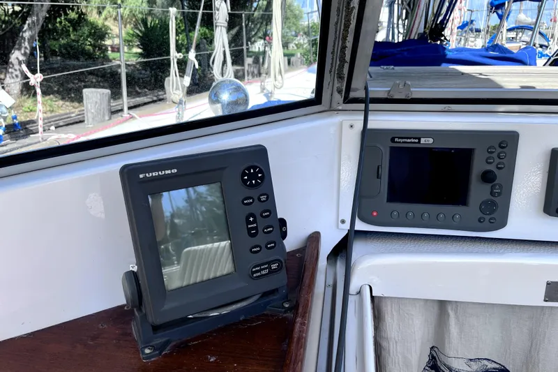 Arma Di Re Yacht Photos Pics Navigation equipment on 1983 Hallberg-Rassy 42E sailboat, featuring Furuno and Raymarine displays.