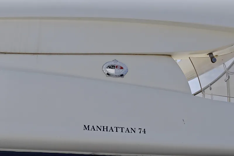  Yacht Photos Pics 2001 Sunseeker Manhattan 74 yacht, close-up of model name and emblem.