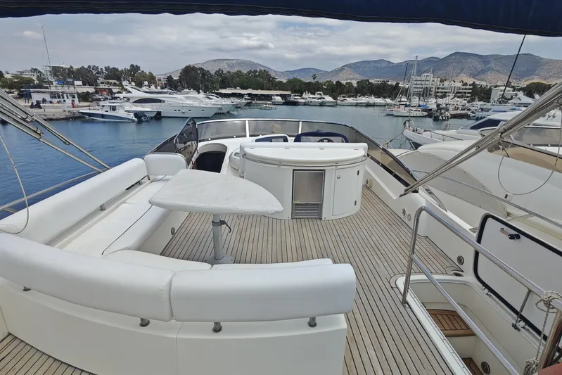  Yacht Photos Pics Luxurious 2001 Sunseeker Manhattan 74 yacht docked in a scenic marina.