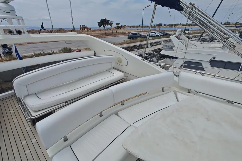  Yacht Photos Pics Luxurious 2001 Sunseeker Manhattan 74 yacht with spacious white seating on deck.