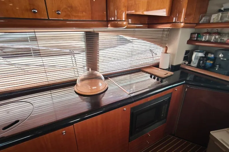  Yacht Photos Pics Luxurious kitchen interior of 2001 Sunseeker Manhattan 74 yacht with modern appliances.