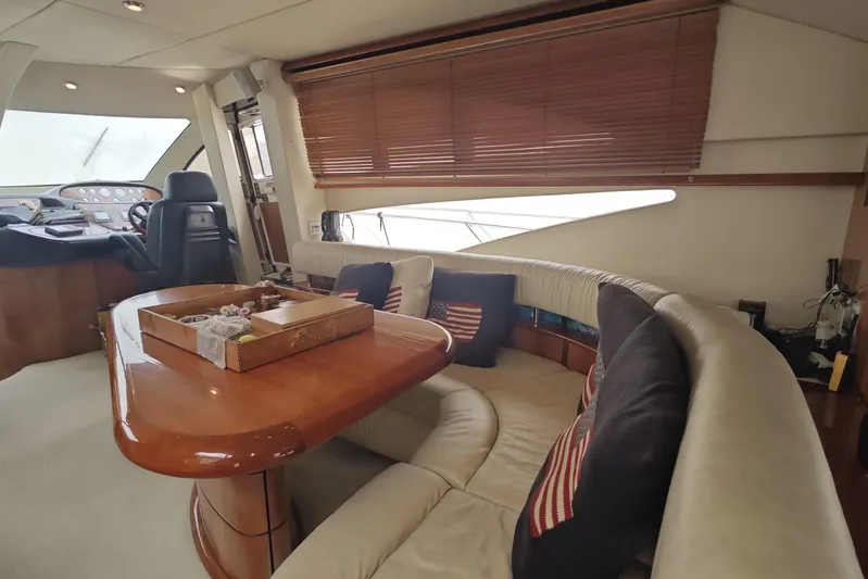  Yacht Photos Pics Luxurious interior of 2001 Sunseeker Manhattan 74 yacht with elegant seating and helm.