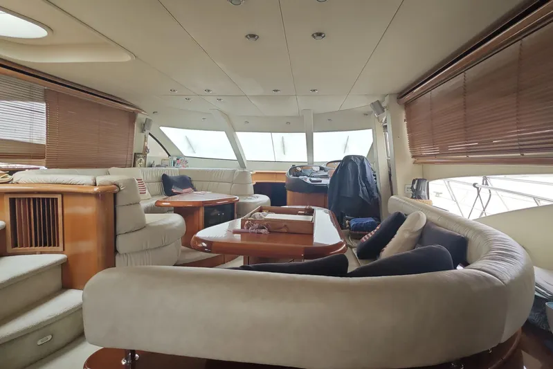  Yacht Photos Pics Luxurious interior of a 2001 Sunseeker Manhattan 74 yacht with plush seating and elegant design.