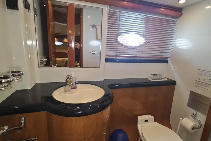  Yacht Photos Pics Luxurious bathroom interior of 2001 Sunseeker Manhattan 74 yacht with modern fixtures.