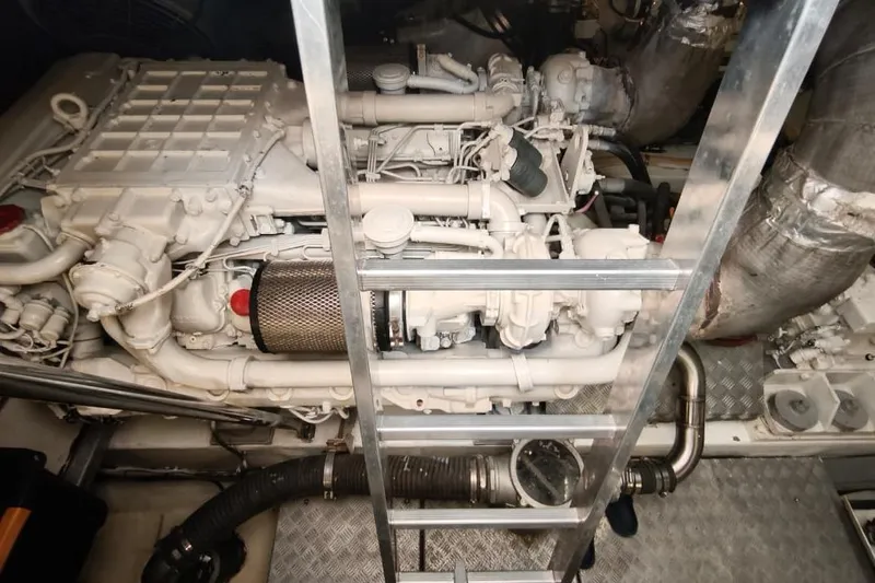  Yacht Photos Pics Engine room of 2001 Sunseeker Manhattan 74 yacht, featuring a powerful marine engine.