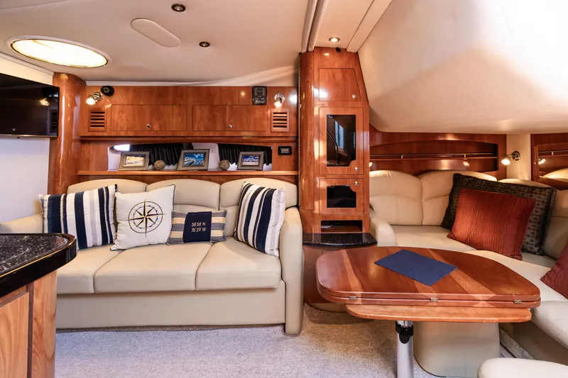 Four Fans Yacht Photos Pics Luxurious interior of 2008 Four Winns V378 yacht with elegant seating and wooden accents.