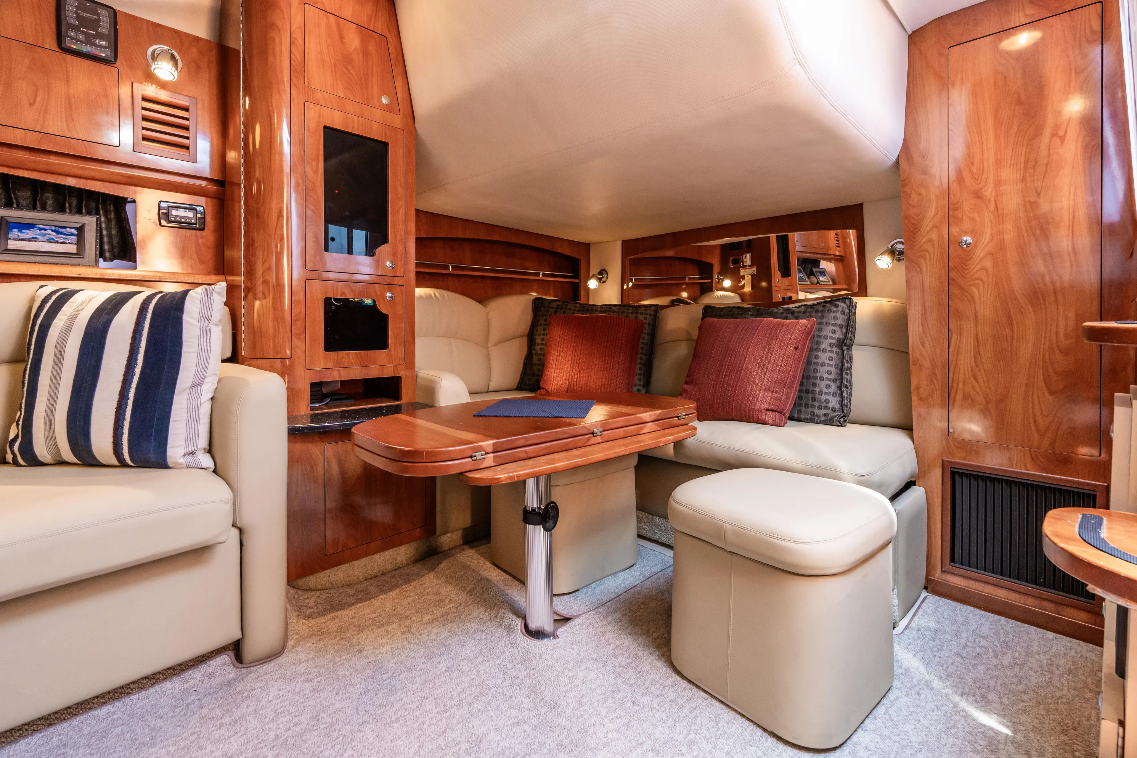 Four Fans Yacht Photos Pics Luxurious interior of 2008 Four Winns V378 yacht with plush seating and wooden accents.