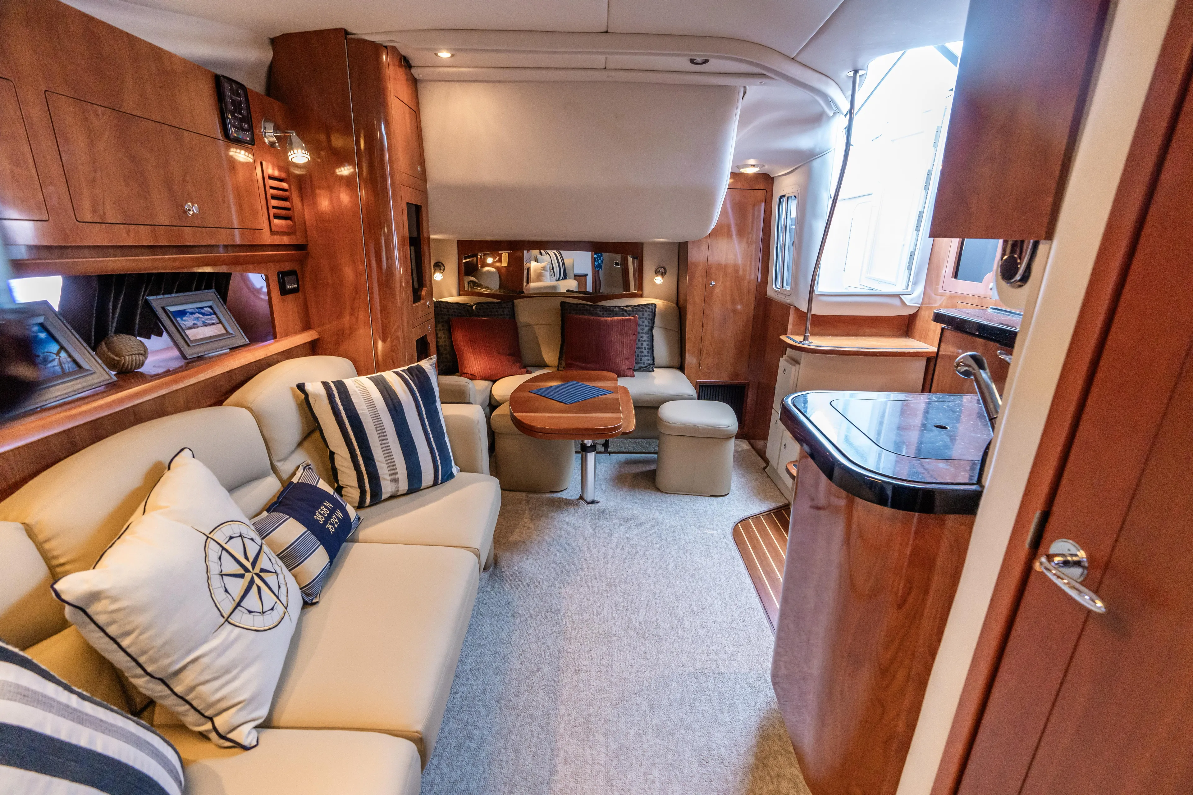 Four Fans Yacht Photos Pics Luxurious 2008 Four Winns V378 yacht interior with plush seating and elegant wood finishes.