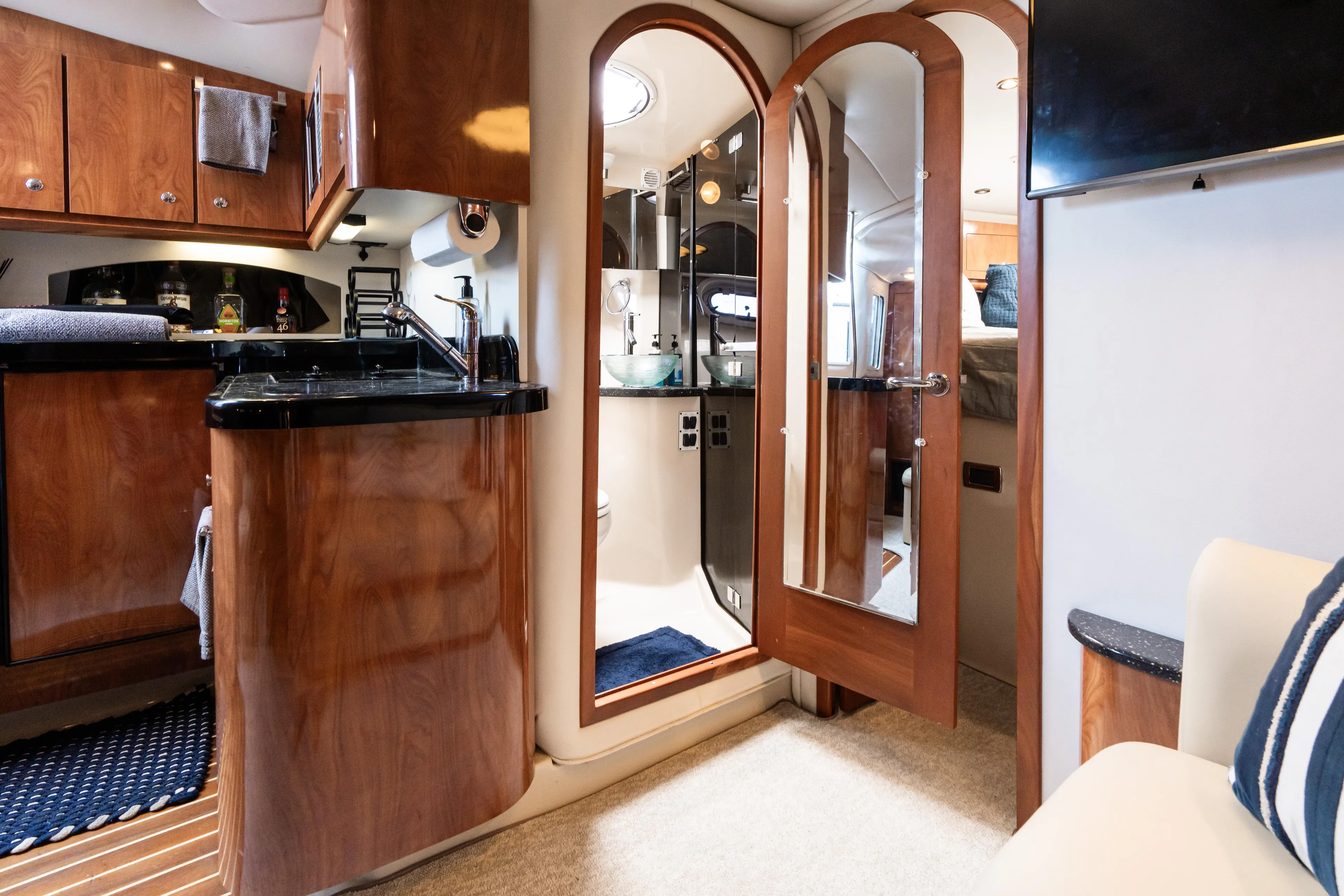 Four Fans Yacht Photos Pics Luxurious 2008 Four Winns V378 yacht interior with elegant wood finishes and modern amenities.