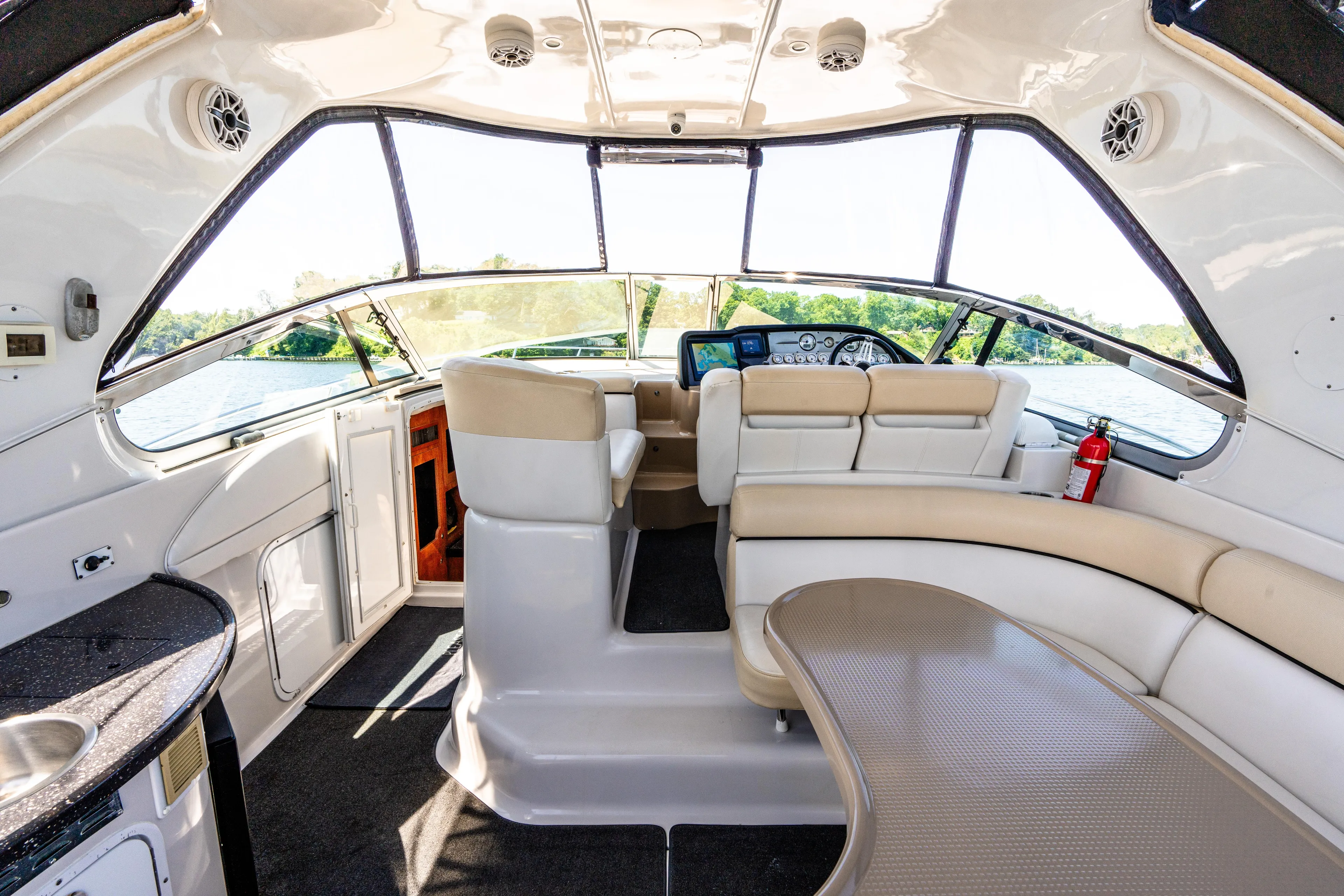 Four Fans Yacht Photos Pics Interior of 2008 Four Winns V378 yacht with luxurious seating and modern dashboard.