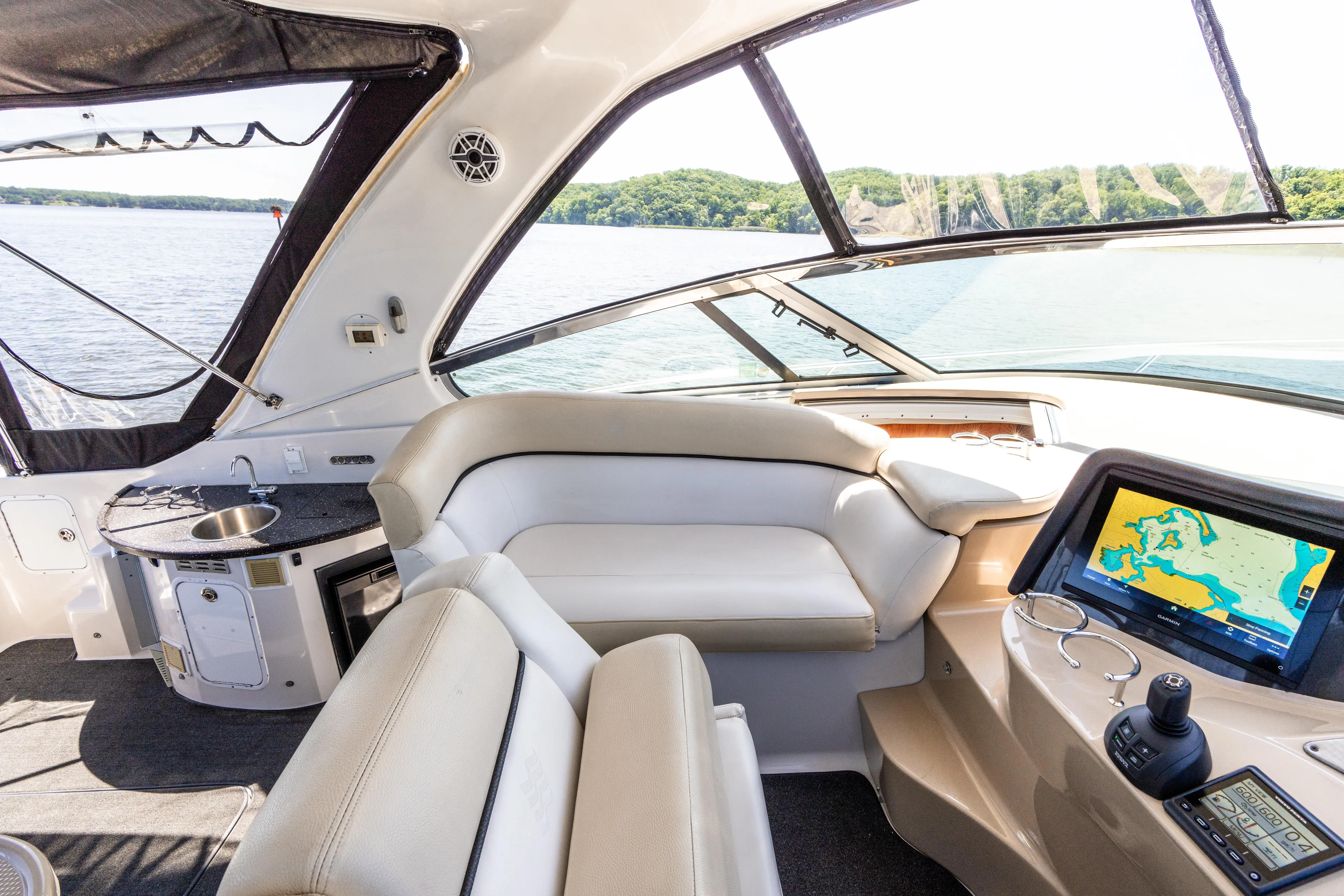 Four Fans Yacht Photos Pics Luxurious 2008 Four Winns V378 yacht interior with navigation system and comfortable seating.