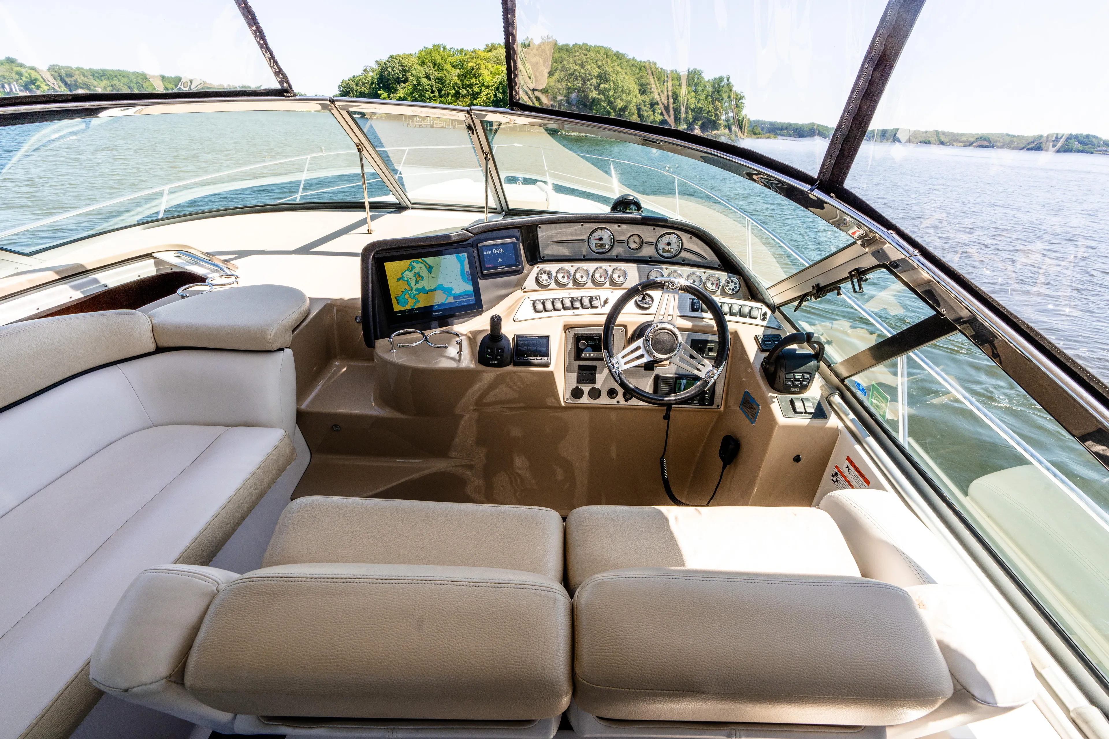 Four Fans Yacht Photos Pics 2008 Four Winns V378 yacht cockpit with luxurious seating and modern navigation equipment.