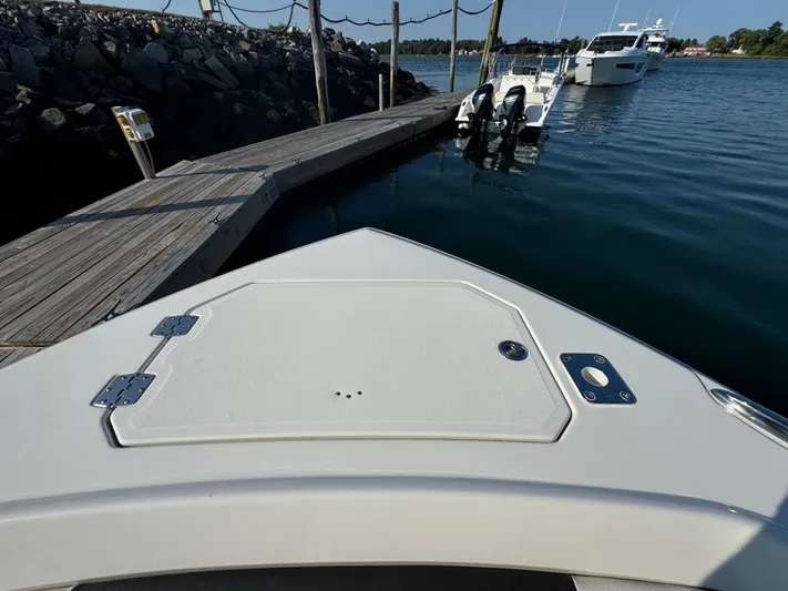  Yacht Photos Pics Bow view of 2023 Sailfish 312 CC boat docked at marina.