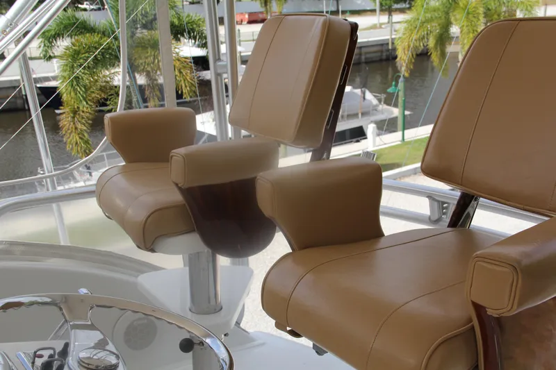  Yacht Photos Pics Luxurious leather seats on 2005 Cabo Flybridge CAT C18 yacht, dockside view.