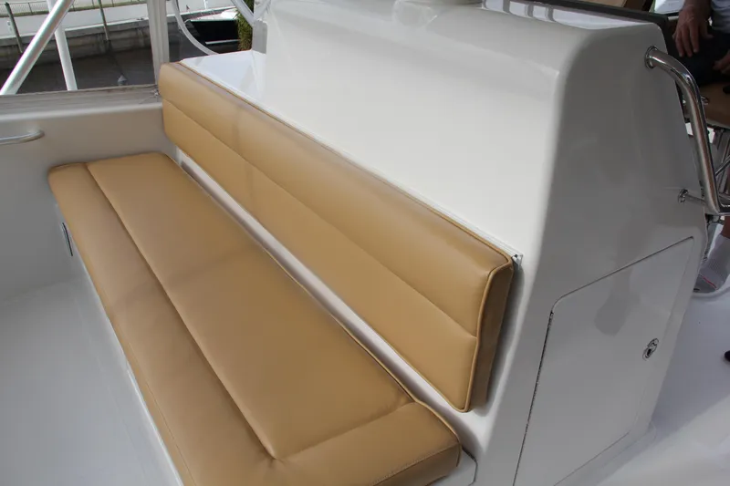  Yacht Photos Pics 2005 Cabo Flybridge CAT C18 boat with tan cushioned seating.