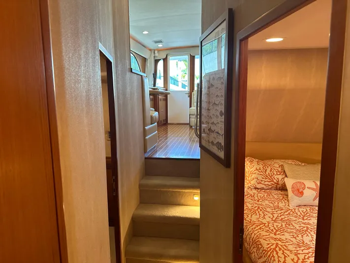  Yacht Photos Pics 2005 Cabo Flybridge CAT C18 interior with cozy cabin and wooden flooring.