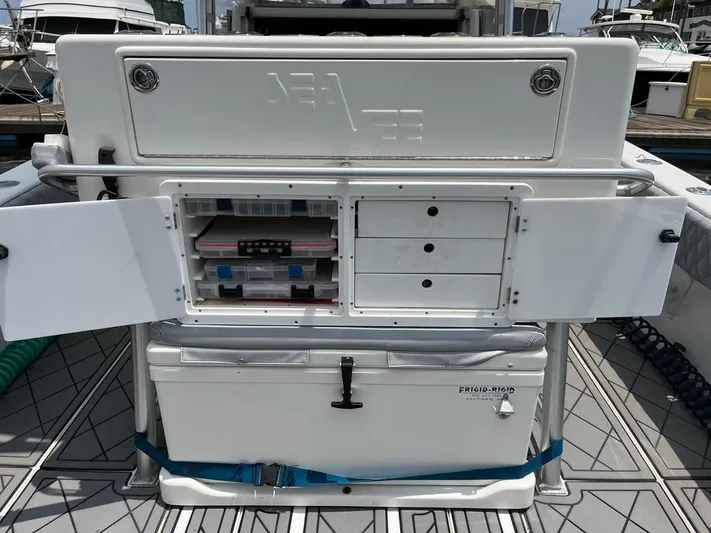 Albie Fishing Yacht Photos Pics 2007 SeaVee 34B boat with open storage compartments and cooler on deck.