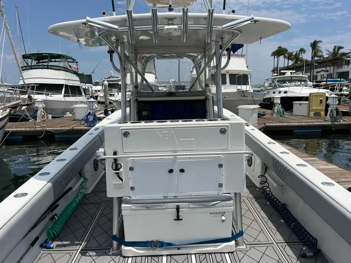 Albie Fishing Yacht Photos Pics 2007 SeaVee 34B boat docked at marina, featuring center console and fishing equipment.