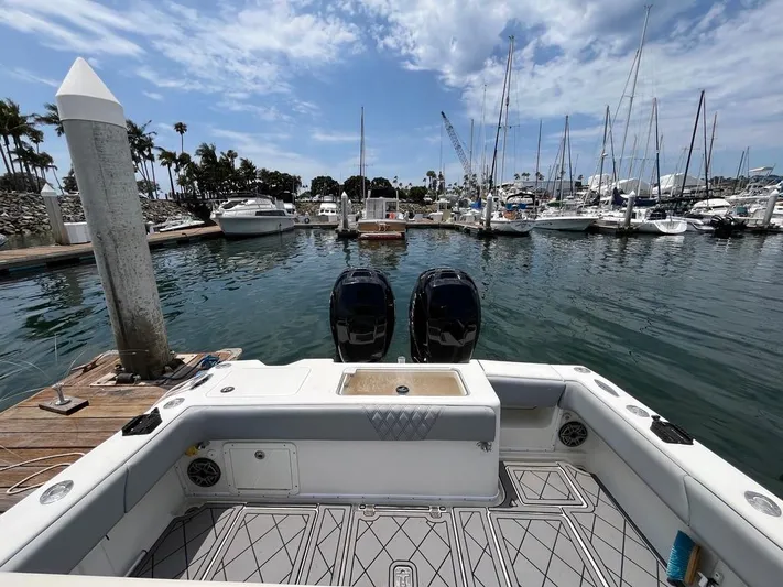 Albie Fishing Yacht Photos Pics 2007 SeaVee 34B boat docked in a marina with twin engines and clear skies.