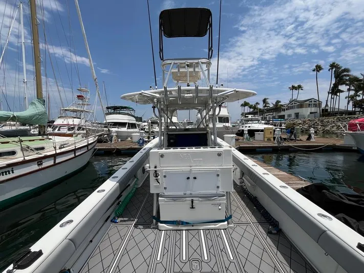 Albie Fishing Yacht Photos Pics 2007 SeaVee 34B boat docked at marina, surrounded by other vessels and palm trees.