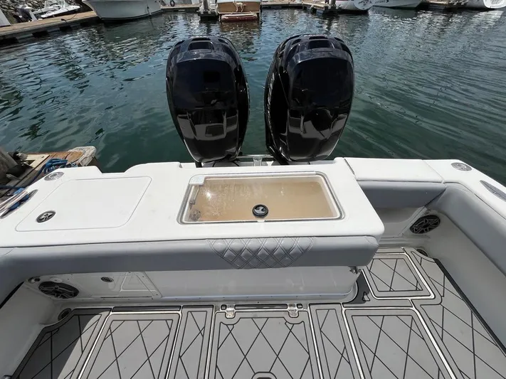 Albie Fishing Yacht Photos Pics 2007 SeaVee 34B boat with dual engines, docked in a marina.