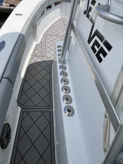 Albie Fishing Yacht Photos Pics 2007 SeaVee 34B boat deck with rod holders and non-slip flooring.