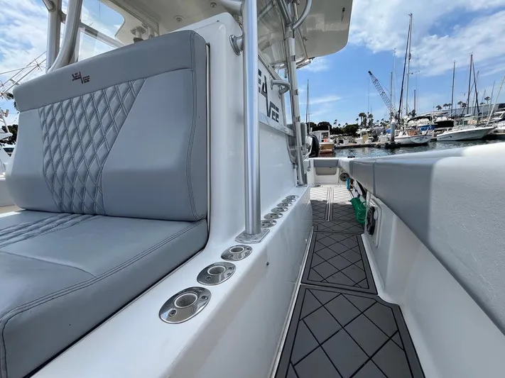 Albie Fishing Yacht Photos Pics 2007 SeaVee 34B boat interior with gray seating and marina view.