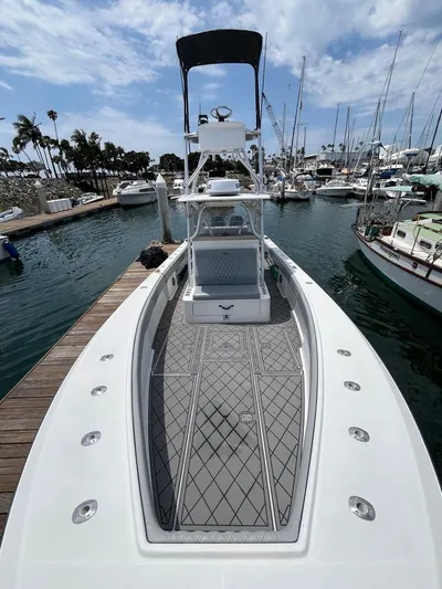 Albie Fishing Yacht Photos Pics 2007 SeaVee 34B boat docked in marina, featuring spacious deck and tower.