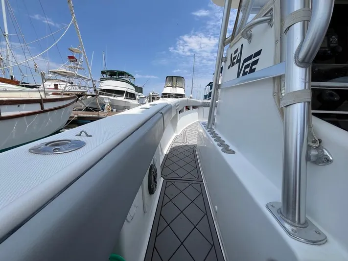 Albie Fishing Yacht Photos Pics 2007 SeaVee 34B boat docked, showcasing sleek design and spacious deck under clear blue sky.