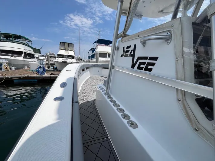 Albie Fishing Yacht Photos Pics 2007 SeaVee 34B boat docked at marina, showcasing sleek design and spacious deck.