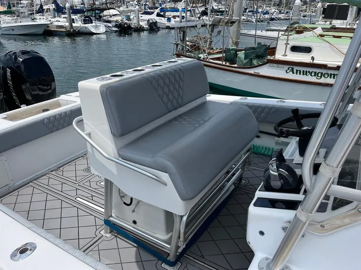 Albie Fishing Yacht Photos Pics 2007 SeaVee 34B boat interior with gray seating, docked in a marina.