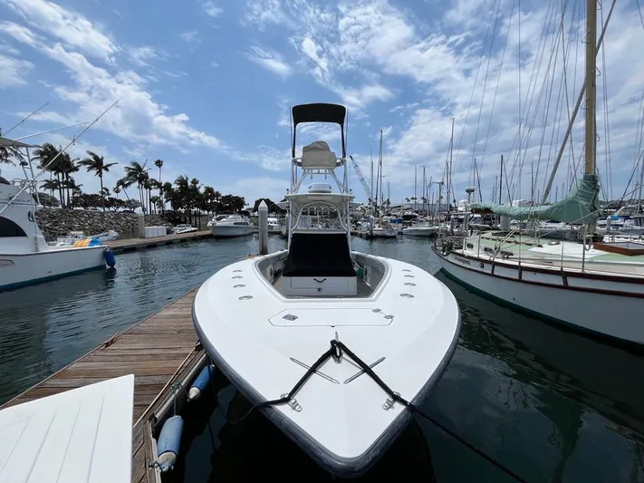 Albie Fishing Yacht Photos Pics 2007 SeaVee 34B boat docked at marina under partly cloudy sky.