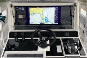 Albie Fishing Yacht Photos Pics 2007 SeaVee 34B boat dashboard with navigation screen and controls.