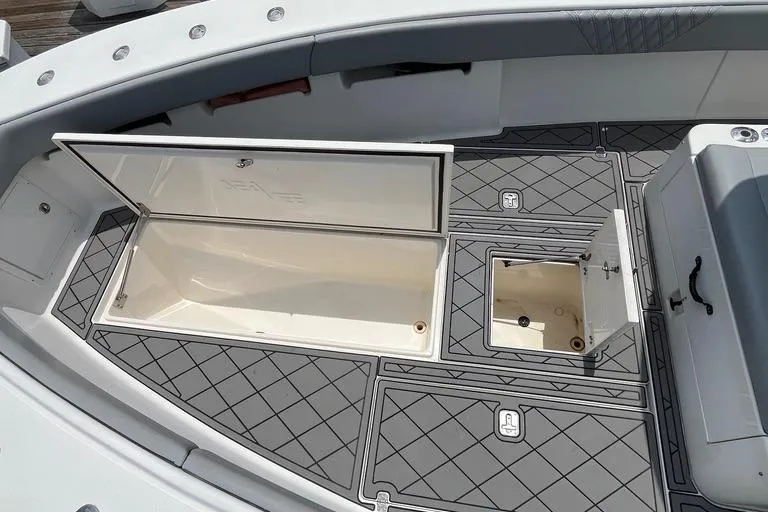 Albie Fishing Yacht Photos Pics 2007 SeaVee 34B boat deck with open storage compartments, featuring non-slip flooring.