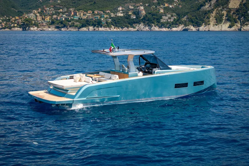  Yacht Photos Pics 2026 Pardo Yachts P43 cruising on blue ocean near scenic coastline.