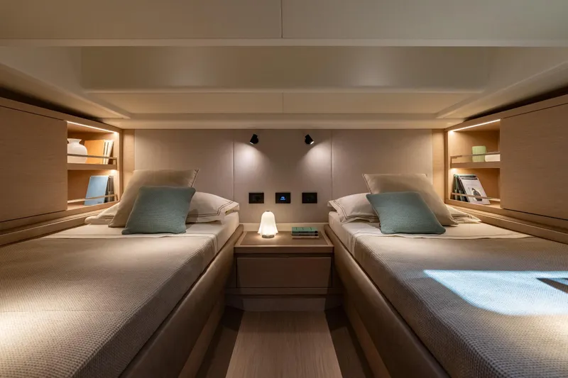  Yacht Photos Pics Luxurious twin cabin interior of 2026 Pardo Yachts P43, featuring modern design and ambient lighting.