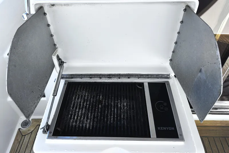 Times Like These Yacht Photos Pics Outdoor grill on 2004 McKinna 57 PHMY Widebody yacht, featuring Kenyon cooking surface.