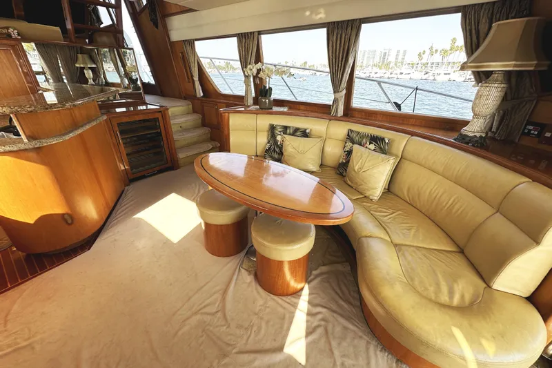 Times Like These Yacht Photos Pics Luxurious interior of 2004 McKinna 57 PHMY yacht with elegant seating and scenic window views.
