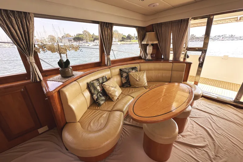 Times Like These Yacht Photos Pics Luxurious interior of 2004 McKinna 57 PHMY yacht with elegant seating and scenic views.