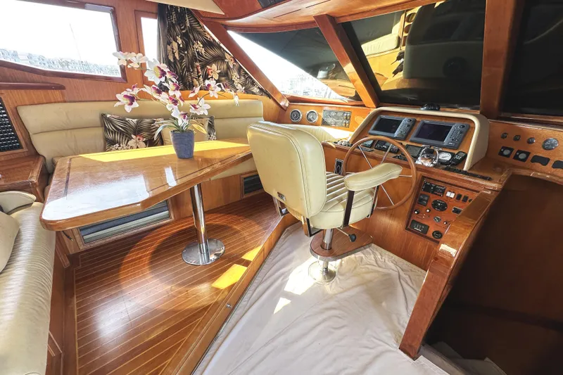 Times Like These Yacht Photos Pics Luxurious 2004 McKinna 57 PHMY yacht interior with wood finish and floral decor.