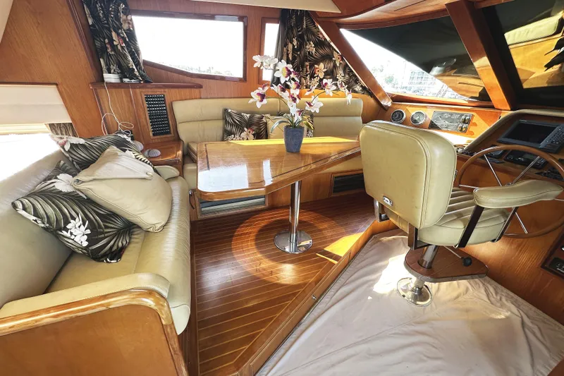 Times Like These Yacht Photos Pics Luxurious interior of a 2004 McKinna 57 PHMY yacht with elegant seating and floral decor.