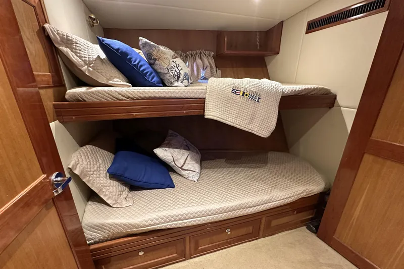 Times Like These Yacht Photos Pics Bunk beds in 2004 McKinna 57 PHMY yacht cabin with cozy pillows and blankets.
