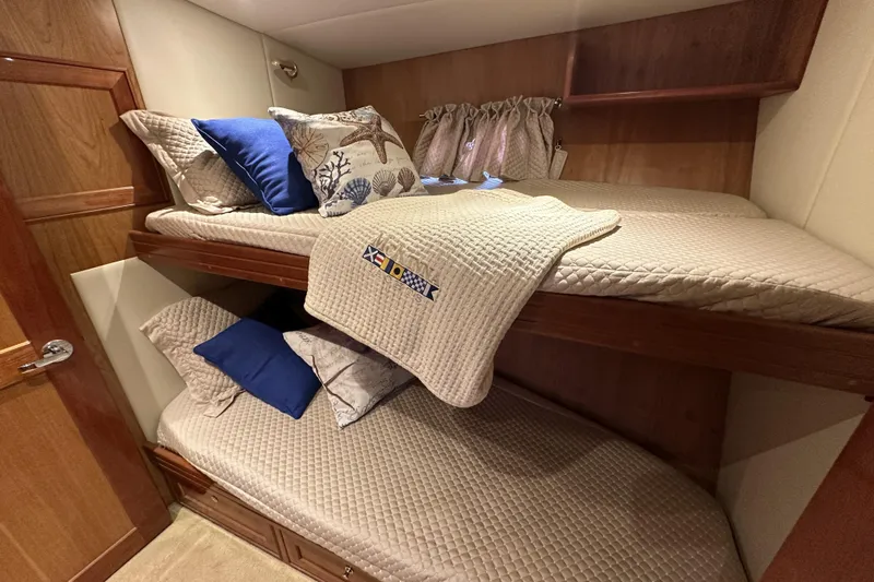 Times Like These Yacht Photos Pics Bunk beds in 2004 McKinna 57 PHMY yacht cabin with nautical-themed pillows.