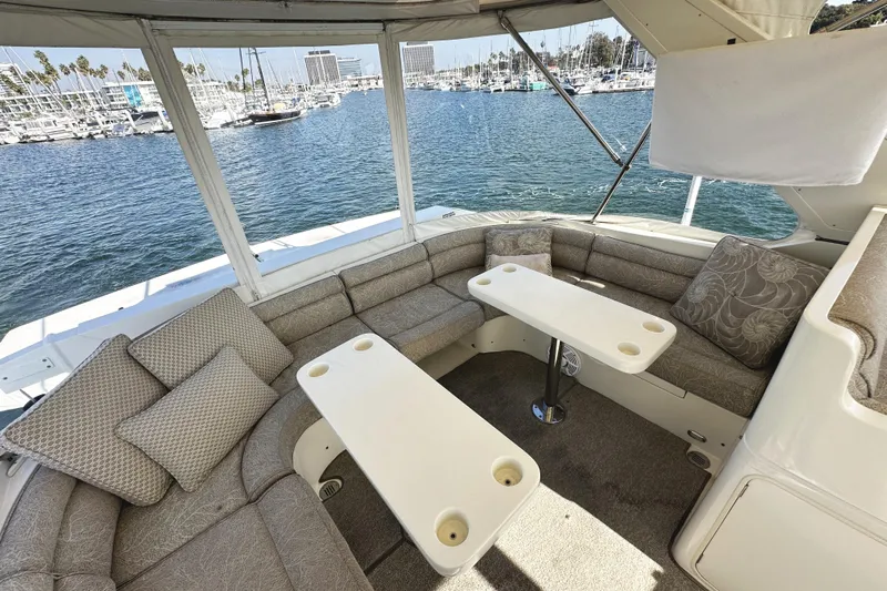 Times Like These Yacht Photos Pics Luxurious seating area on 2004 McKinna 57 PHMY yacht, overlooking marina.