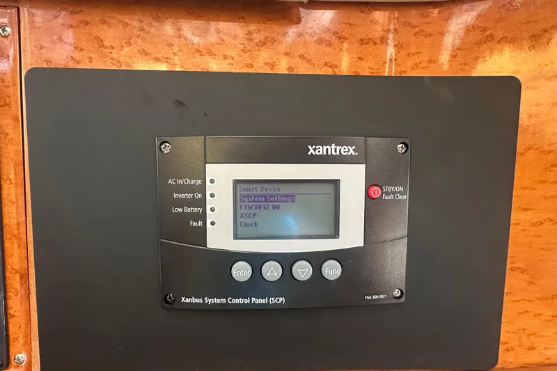 Times Like These Yacht Photos Pics Xantrex control panel on 2004 McKinna 57 PHMY Widebody yacht, displaying system settings.