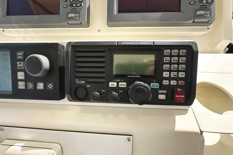 Times Like These Yacht Photos Pics Control panel of a 2004 McKinna 57 PHMY Widebody yacht with navigation equipment.
