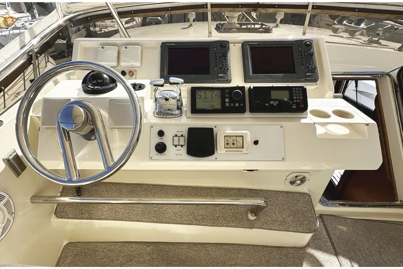 Times Like These Yacht Photos Pics 2004 McKinna 57 PHMY yacht helm with dual navigation screens and control panel.