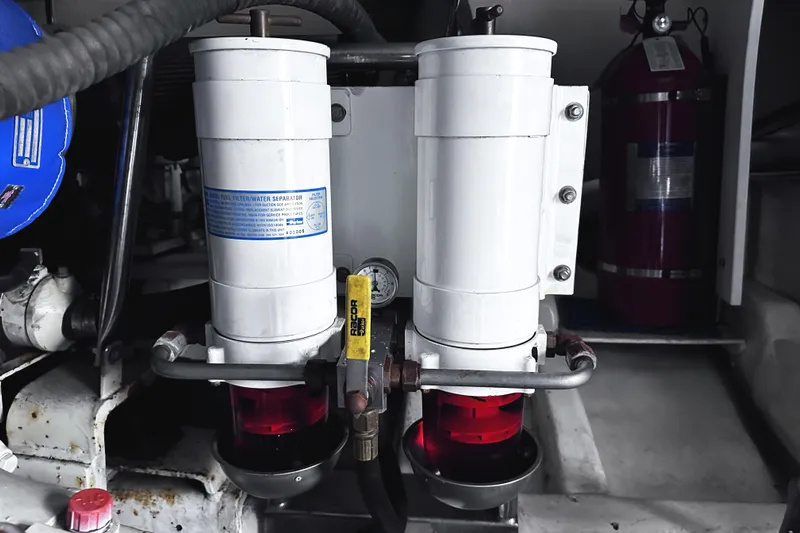 Times Like These Yacht Photos Pics Engine room of 2004 McKinna 57 PHMY yacht with fuel filter system.