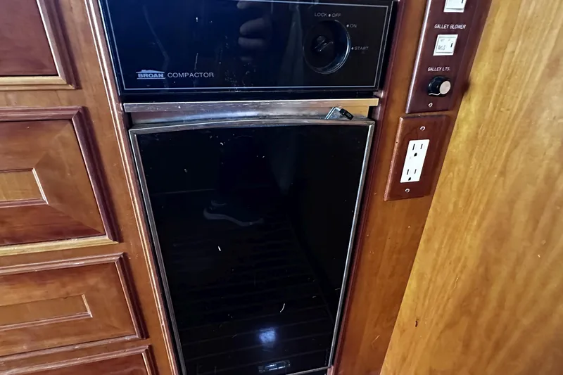 Times Like These Yacht Photos Pics Built-in Broan compactor in 2004 McKinna 57 PHMY yacht galley.